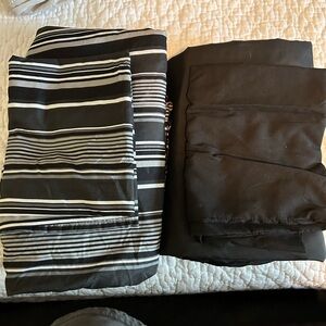 Two sets Twin XL sheet. Black set and striped set. EUC.